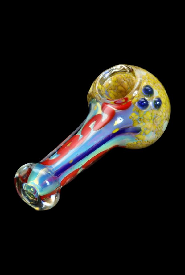 Colorful glass smoking pipe with textured bowl against a black background.