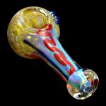 Hand pipe with colorful glass swirls.