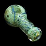 Hand-blown glass pipe with swirling green and blue patterns.