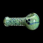 Green glass pipe with colorful swirling patterns and a sculpted face on the bowl.