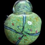 Green and blue patterned glass cannabis water pipe.