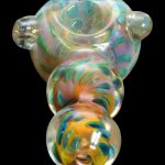 Hand-blown glass bubbler with iridescent swirls.