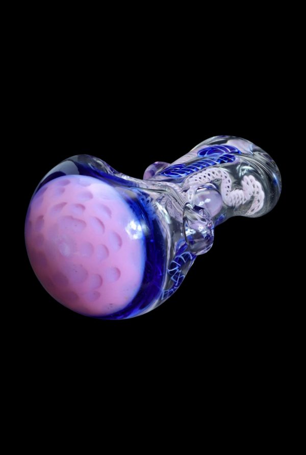 Handblown glass pipe with vibrant purple and blue coloration.