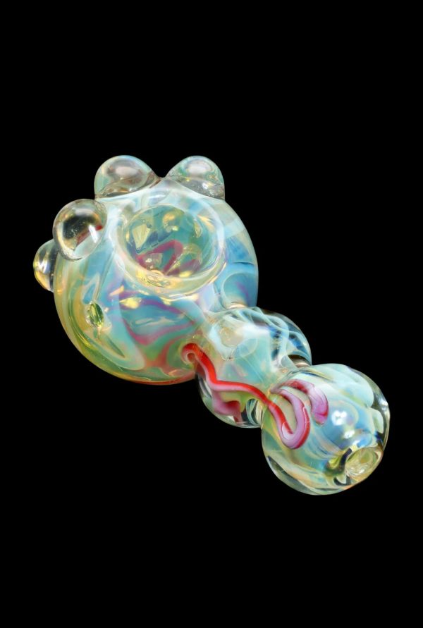 Hand-blown glass pipe with iridescent swirls and red accents.