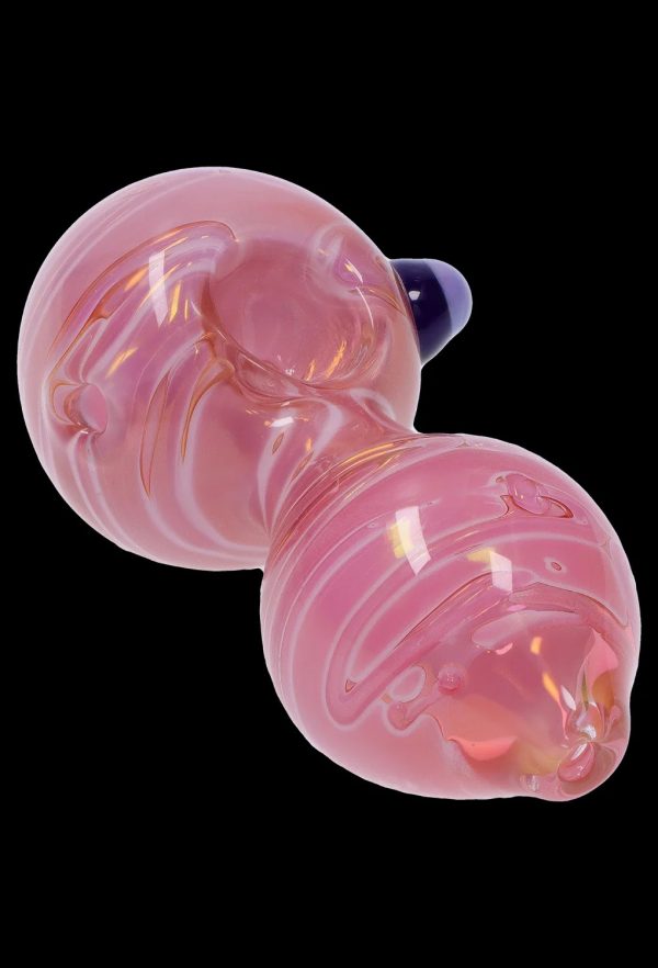 Pink glass bubbler for smoking cannabis.