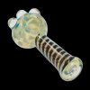 A close-up, angled view of the Dicro Spoon Pipe - 4.5 in., showcasing its smooth glass form and unique dichroic finish.