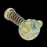 Glass pipe with striped handle and rounded bowl, isolated on a black background.