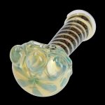 A side view of the 4.5-inch Dicro Spoon Pipe, showing its curved shape and colorful dichroic glass finish.