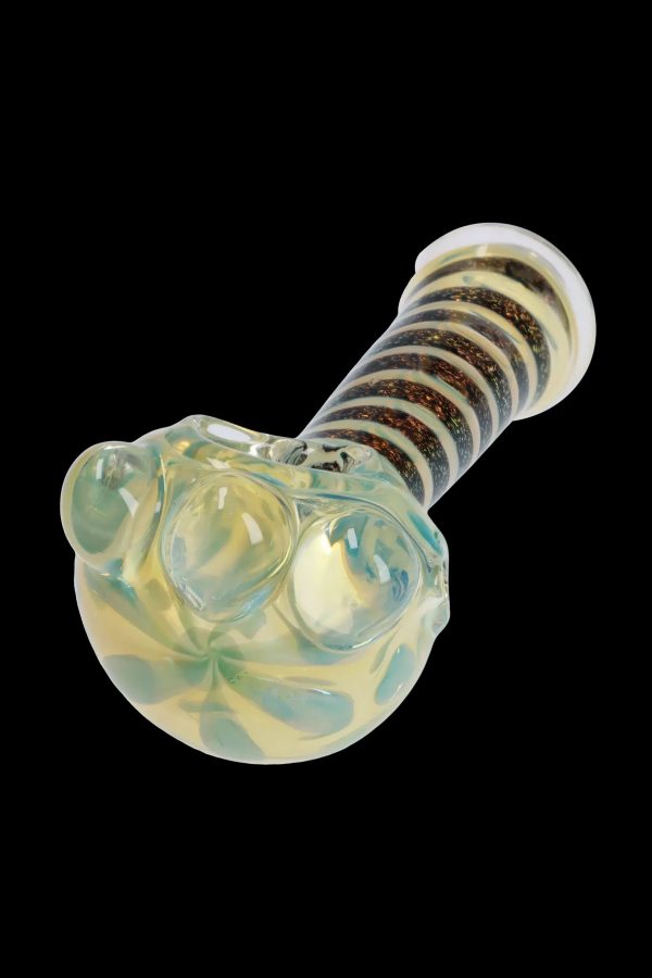 A side view of the 4.5-inch Dicro Spoon Pipe, showing its curved shape and colorful dichroic glass finish.
