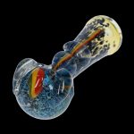 Hand-blown glass pipe with blue and amber swirls against a black background.
