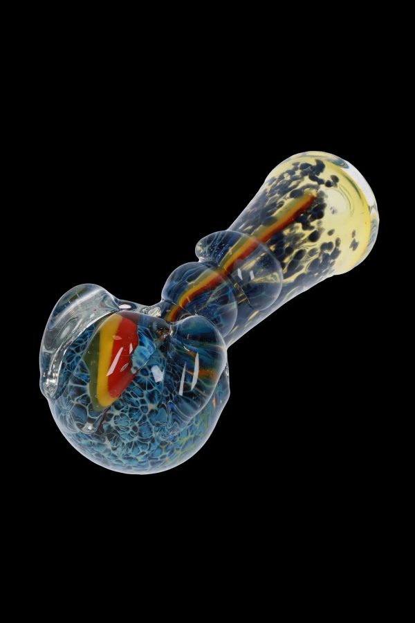 Hand-blown glass pipe with blue and amber swirls against a black background.