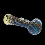 Blue and yellow glass pipe isolated on a black background.
