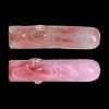 Pink glass pipe with floral swirls, displayed twice against a black background.