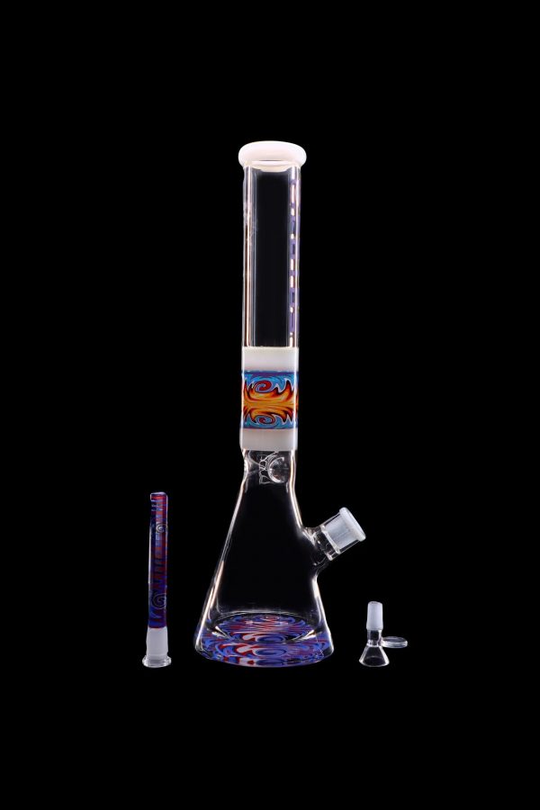 A vibrant glass bong with colorful swirling patterns, displayed with its downstem and bowl against a black background.