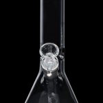 Clear glass bong with ice catcher, isolated on black.