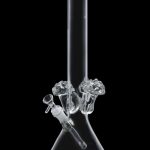 Clear glass bong with percolator, isolated on black.