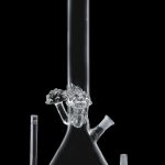 Clear glass bong with ice catcher, downstem, and bowl, isolated on a black background.
