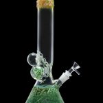 Green glass water pipe (bong) with intricate sculpted details.