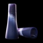 Purple silicone cannabis pipe screens against a black background.