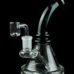 Clear glass water pipe (rig) with a quartz banger, isolated on black.