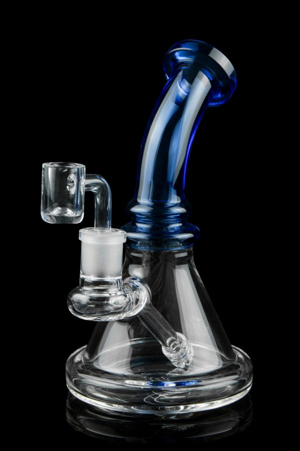 Blue and clear glass dab rig with a quartz banger, isolated on black.