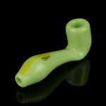 Light green glass pipe with orange lettering, studio shot on a black background.
