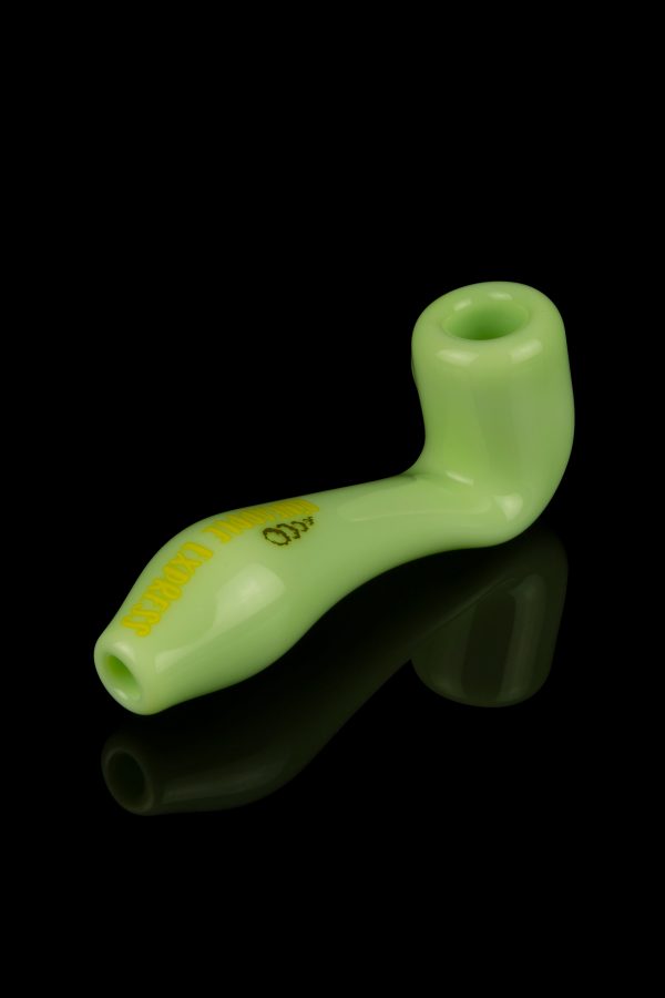 Light green glass pipe with orange lettering, studio shot on a black background.