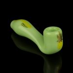 Pale green glass pipe with gold cannabis leaf detailing, studio shot on black.