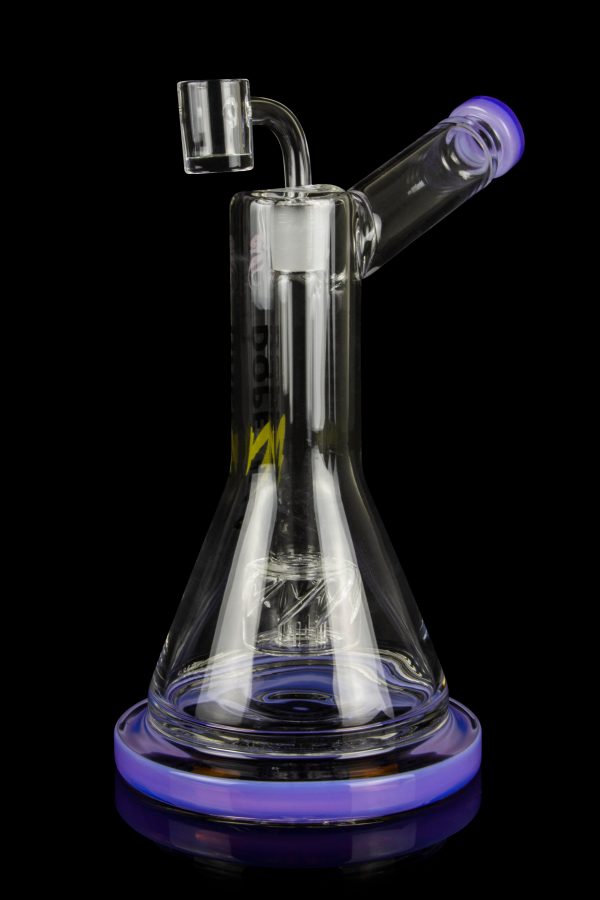 Purple and clear glass dab rig with intricate internal diffusion and a quartz banger.