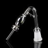 Clear glass oil rig attachment with a rounded reservoir and angled mouthpiece, reflecting on a black surface."