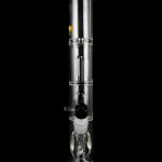 Clear glass bubbler water pipe with ice pinches and a removable diffuser downstem, isolated on a black background.