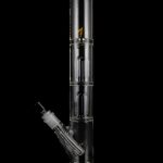 Glass water pipe (bong) with multiple chambers and a downstem, isolated on a black background.