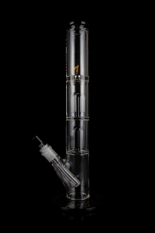 Glass water pipe (bong) with multiple chambers and a downstem, isolated on a black background.