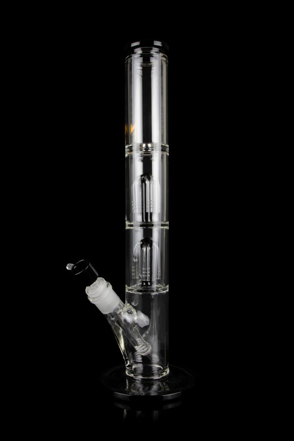 Clear glass bong with multiple diffusion chambers and a glass bowl, isolated on a black background.