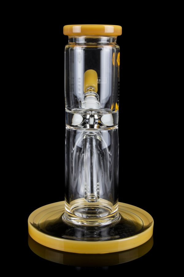 Clear glass water pipe (rig) with a golden base and mouthpiece cap, studio shot on a black background.