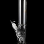 Clear glass water pipe (bong) with a percolator, isolated on a black background.
