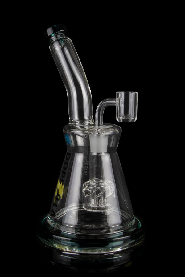 Clear glass dab rig with intricate percolator and quartz banger, isolated on a black background.