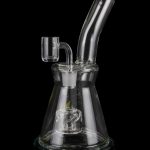 Clear glass water pipe (rig) with intricate bubbler design, isolated on a black background.