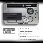 Close-up of a sleek, black cannabis grinder with labeled features including a smell-proof storage compartment, magnetic lock, removable tray, and cone holders.