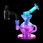 A colorful glass dab rig with a quartz banger, isolated on a black background.