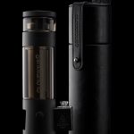 Black Cloudious9 vaporizer pen and carrying case on a dark background.