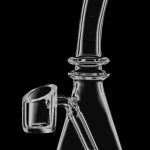Front view of the Mini All-In-One Quartz Oil Rig, showing the clear glass setup angled against a dark background.