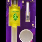 A packaged set of gold-toned cannabis accessories including a pipe, cartridge, and metal plate, branded with “Freak Street.”