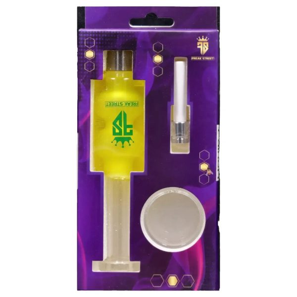 Purple retail packaging displays a gold-colored oil rig, a white cartridge, and a small container, branded with "Freak Street."