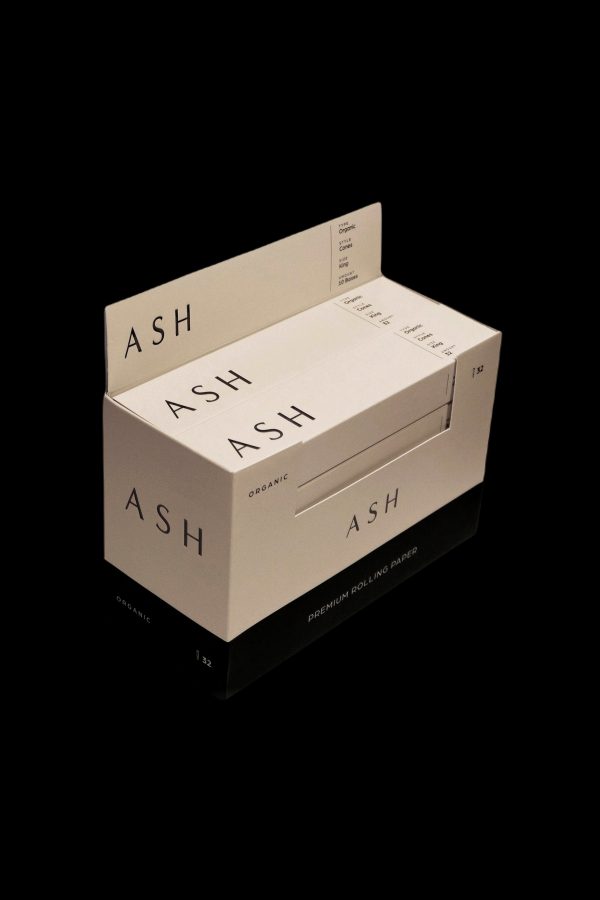 Stacked boxes of “ASH Organic” premium rolling papers on a white background.