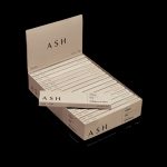 Pack of ASH branded organic rolling papers and filters displayed open on a dark background.