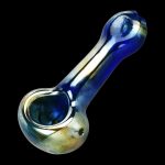 A close-up, angled view of the Lightweight Glass Spoon Pipe - Oil Slick, showcasing its iridescent, swirling colors and curved form.
