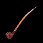 Wooden cannabis pipe with ornate metal detailing against a black background.