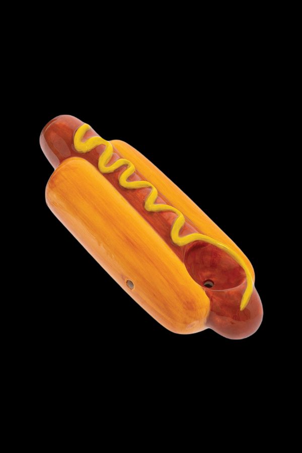 Glass pipe shaped like a hot dog with yellow “mustard” swirls.