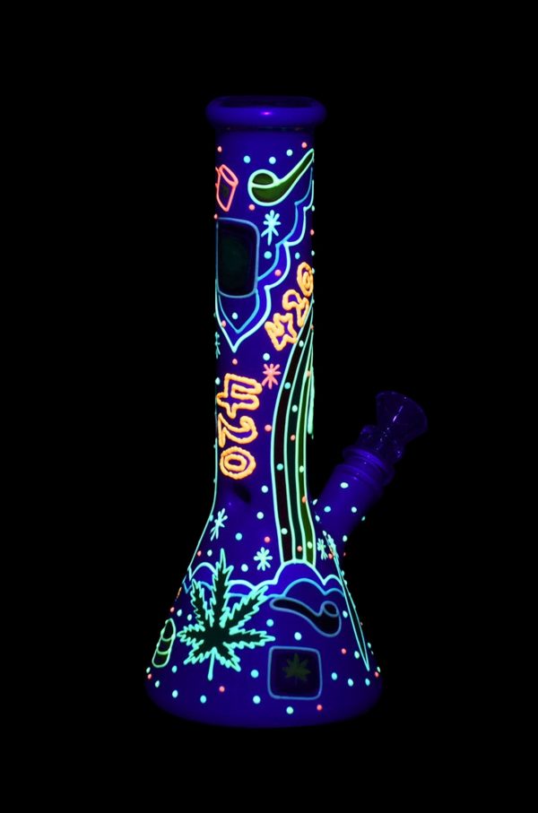 Glowing glass bong with cannabis leaf and “420” designs on a black background.